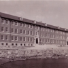 <p><strong>Colonial Revival</strong>: A later example of the style, now greatly simplified. Barracks (Building 59), built 1939, showing the east facade in a view to west-northwest, ca. 1940.</p>